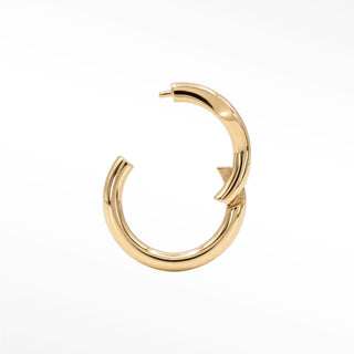 Cartilage hoop earrings featuring a minimalist 14k gold marquise silhouette. Sculpt your ear stack
