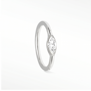 Cartilage hoop earrings featuring a high-brilliance marquise moissanite in 14k white gold. Illuminate your ear stack