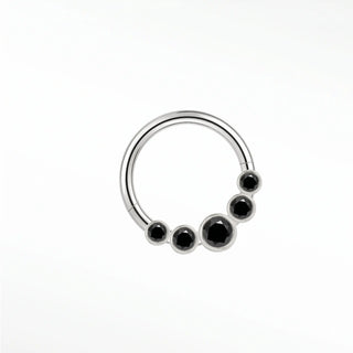 Cartilage hoop earrings featuring a bold sunburst of five bezel-set black diamonds in 14k white gold. Introduce dark