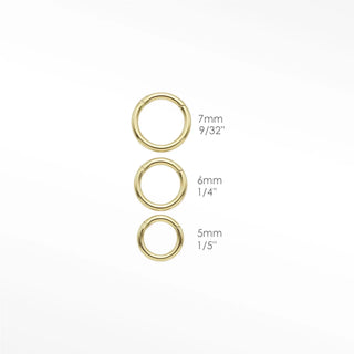 Cartilage hoop earrings in 14k gold featuring a polished 18g finish. Refine your snug ear stack with these high-shine