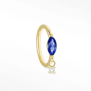 Delicate 14k gold cartilage hoop earrings featuring a marquise-cut blue sapphire and a small dangling diamond accent