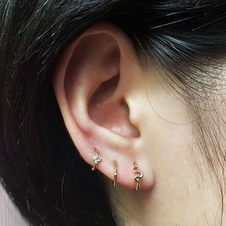 Gold-toned cartilage hoop earring with star texture and intricate coiled snake 14k yellow gold bold body jewelry