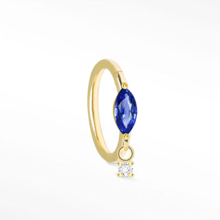 Delicate 14k gold cartilage hoop earrings featuring a marquise-cut blue sapphire and a small dangling diamond accent