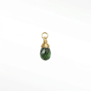 Ear charms crafted in solid 14k gold featuring a faceted green tourmaline briolette drop. Easily slide onto