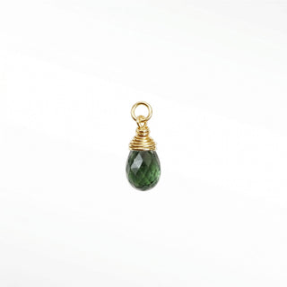Ear charms crafted in solid 14k gold featuring a faceted green tourmaline briolette drop. Easily slide onto