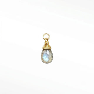 Ear charms crafted in solid 14k gold featuring a faceted labradorite briolette drop. Easily slide onto your favorite
