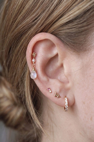 Ear charm crafted in solid 14k gold featuring a lustrous natural pearl and faceted moonstone briolette. Upgrade