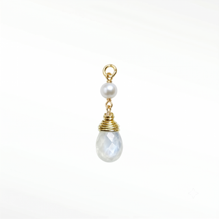 Ear charm crafted in solid 14k gold featuring a lustrous natural pearl and faceted moonstone briolette. Upgrade