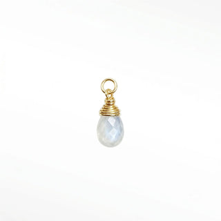 Ear charm crafted in solid 14k gold featuring a stunning faceted moonstone briolette. Upgrade your curation instantly