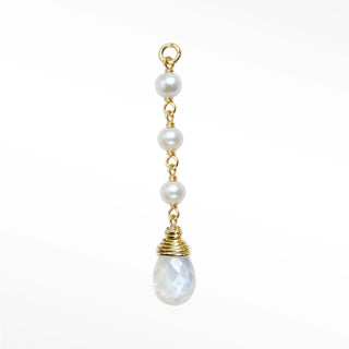 Ear charm crafted in solid 14k gold featuring a beautiful cascade of three natural pearls and faceted moonstone