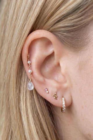 Ear charm crafted in solid 14k gold featuring a beautiful cascade of two natural pearls and faceted moonstone