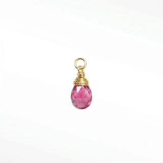 Ear charms crafted in solid 14k gold featuring a faceted pink tourmaline briolette drop. Easily slide onto