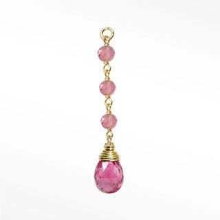 Ear charms showcasing a dramatic three-bead pink tourmaline cascade and hand-selected briolette in solid 14k gold.