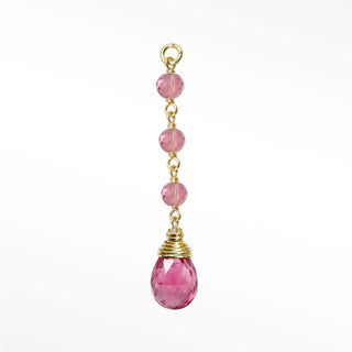 Ear charms showcasing a dramatic three-bead pink tourmaline cascade and hand-selected briolette in solid 14k gold.
