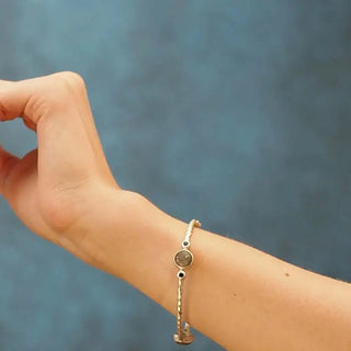 Delicate Chloe labradorite gold vermeil hinged bangle with a textured silver-toned band and central circular stone