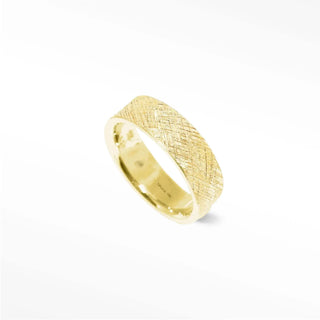 Elevate your style with this unique 14k gold ring. Its textured florentine pattern is eye-catching