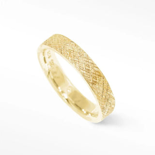A sleek gold cigar band ring florentine in 14k gold featuring a textured crosshatched pattern and polished edges