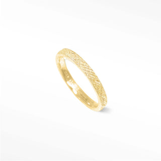 Elevate your style with this unique 14k gold ring. Its textured florentine pattern is eye-catching