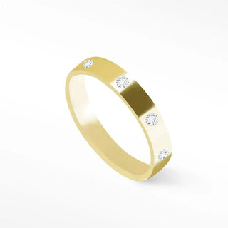 Cigar band ring in 14k gold with four round-cut diamonds set along the band ring surface