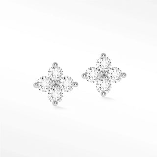 A pair of clover diamond studs in 14k white gold featuring a cross design with clear cubic zirconia stones