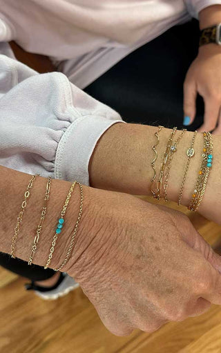 Custom permanent bracelet with subtle charm detailing welded for a Denver client.