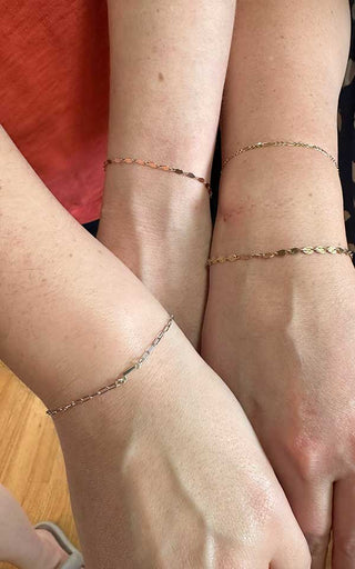Dainty welded bracelets creating a clean clasp-less jewelry look in Denver.