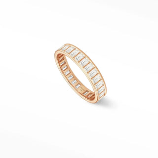 A rose gold quinn diamond eternity ring featuring rectangular-cut clear stones in 14k gold band design