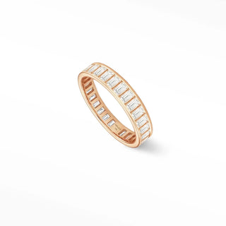 A rose gold quinn diamond eternity ring featuring rectangular-cut clear stones in 14k gold band design