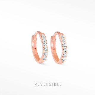 Diamond hoop earrings in 14k rose gold huggie style adorned with a row of sparkling clear stones by natalie wynning