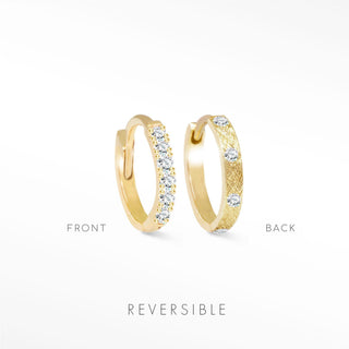 Diamond huggie earrings in 14k yellow gold reversible with clear stones on one side and engraved texture on the other