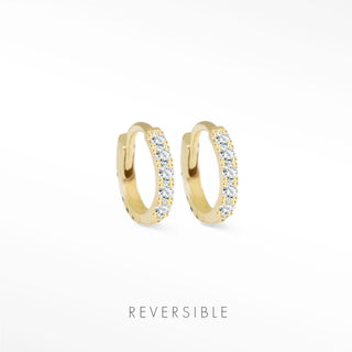 Gold-colored 14k yellow gold huggie earrings adorned with clear sparkling stones diamond huggie earrings