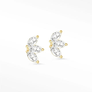 Delicate baby lotus diamond stud earrings in 14k gold with three marquise-cut clear crystals in a leaf pattern