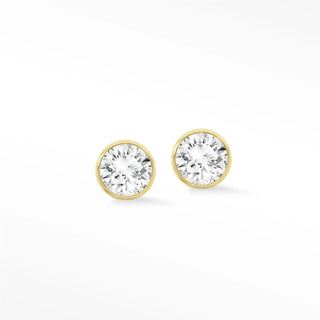Gold-toned 14k gold bezel diamond stud earrings featuring round clear faceted stones in a simple design