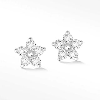 Delicate silver star-shaped diamond stud earrings buttercup 14k white with round diamonds and central pearl