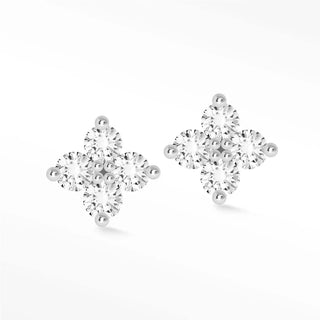 A pair of diamond stud earrings clover 14k white featuring a four-petal flower design with sparkling stones in silver