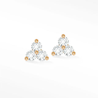 Delicate trinity diamond stud earrings with clear cubic zirconia in 14k rose gold featuring spherical accents