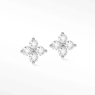 A pair of clover diamond studs in 14k white gold featuring a cross design with clear cubic zirconia stones