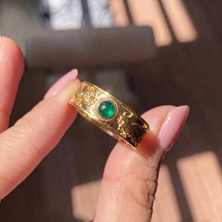 The dragon phoenix emerald ring 14k gold is a captivating fusion of timeless design and natural