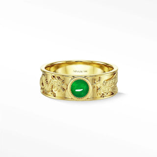 A 14k gold dragon phoenix emerald ring with a central oval natural green jade stone and intricate design
