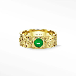 A 14k gold dragon phoenix emerald ring with a central oval natural green jade stone and intricate design