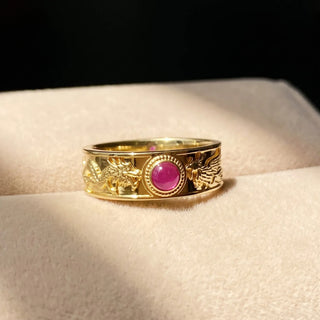 The dragon phoenix ruby ring 14k gold is a stunning symbol of power and passion combining intricate