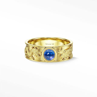 A 14k gold dragon phoenix sapphire ring with intricate engravings and a central blue sapphire for elegant engagement
