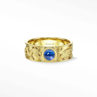 A 14k gold dragon phoenix sapphire ring with intricate engravings and a central blue sapphire for elegant engagement