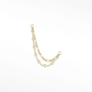 Ear chain connector featuring a tiered double-strand design with classic figaro links and sparkling bezel-set diamonds.