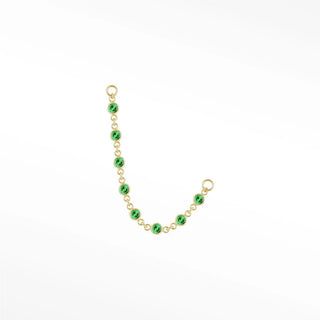 Ear chain by nina wynn. The tiny prismatic emerald features miniature precious green stones in 14k gold. Minimalist