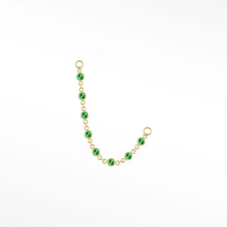 Ear chain by nina wynn. The tiny prismatic emerald features miniature precious green stones in 14k gold. Minimalist