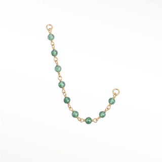 Ear chain by nina wynn. The rock candy collection features timeless natural faceted emerald round beads elegantly