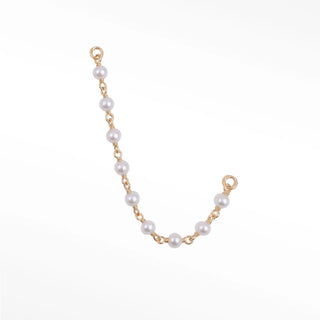 Ear chain handcrafted by nina wynn. The rock candy collection features lustrous natural freshwater pearls beautifully