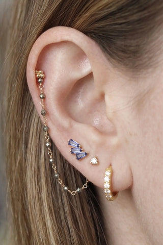 Ear chain from nina wynn’s rock candy collection. Discover a vibrant rainbow-like shimmer of natural faceted pyrite