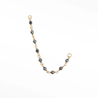 Ear chain from nina wynn’s rock candy collection. Discover a vibrant rainbow-like shimmer of natural faceted pyrite